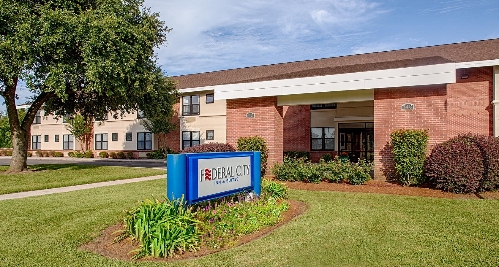 outside front entrance to federal city inn and suites