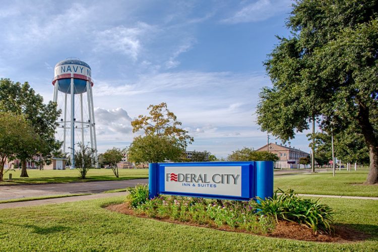 front sign to federal city inn and suites