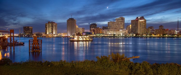 riverboat at night overlooking downtown new orleans